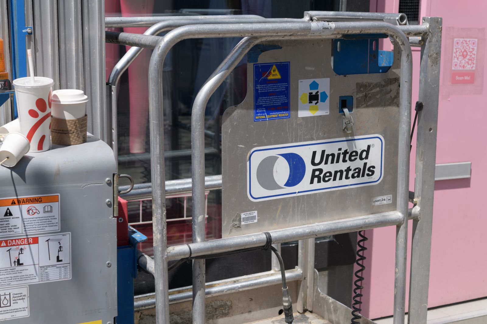 A close-up of the United Rentals sign on equipment by eugen via Adobe Stock