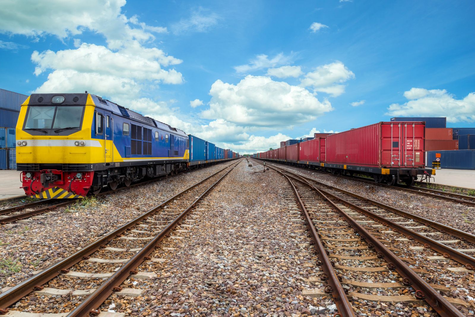 Cargo train platform with freight train container at depot by Prasit Rodphan via Adobe Stock