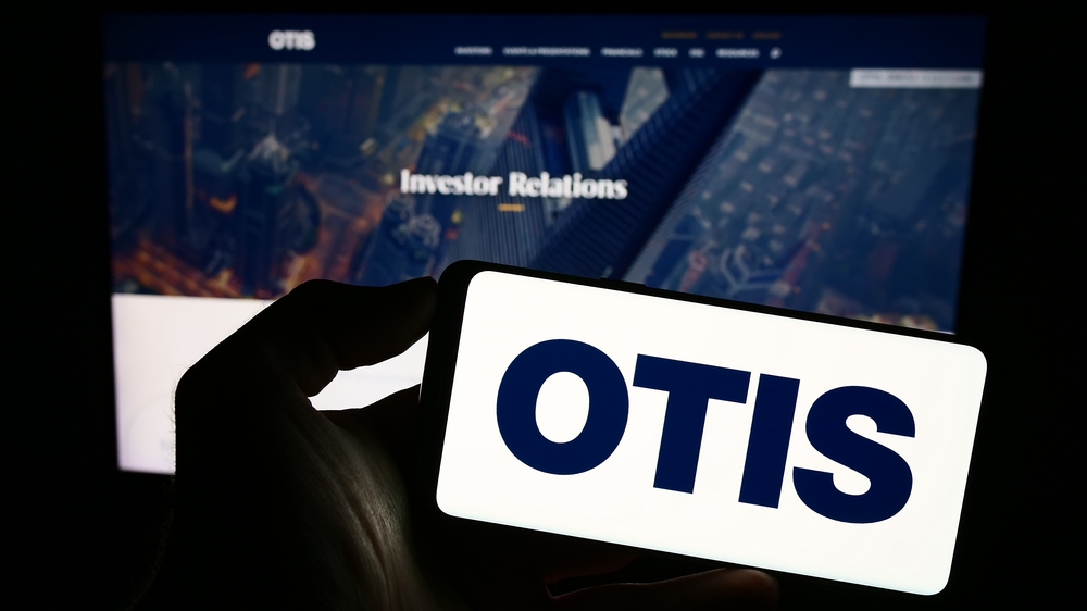 Otis Worldwide Corp logo on phone and website-by T_Schneider via Shutterstock