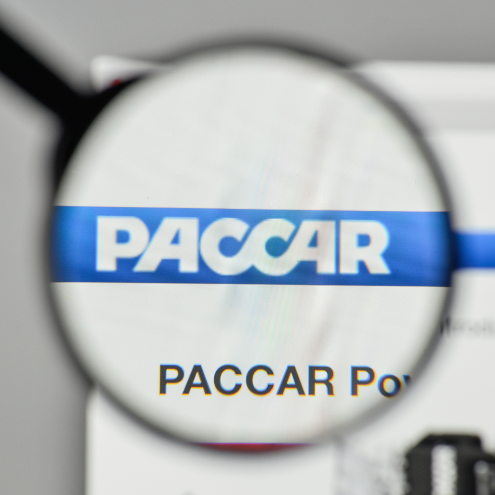 Industrials (names J - Z) - Paccar Inc_ logo magnified by Casimiro PT via Shutterstock