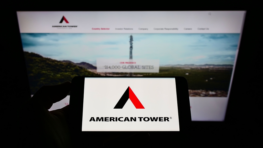 Real Estate - American Tower Corp_ logo on phone and website-by T_Schneider via Shutterstock