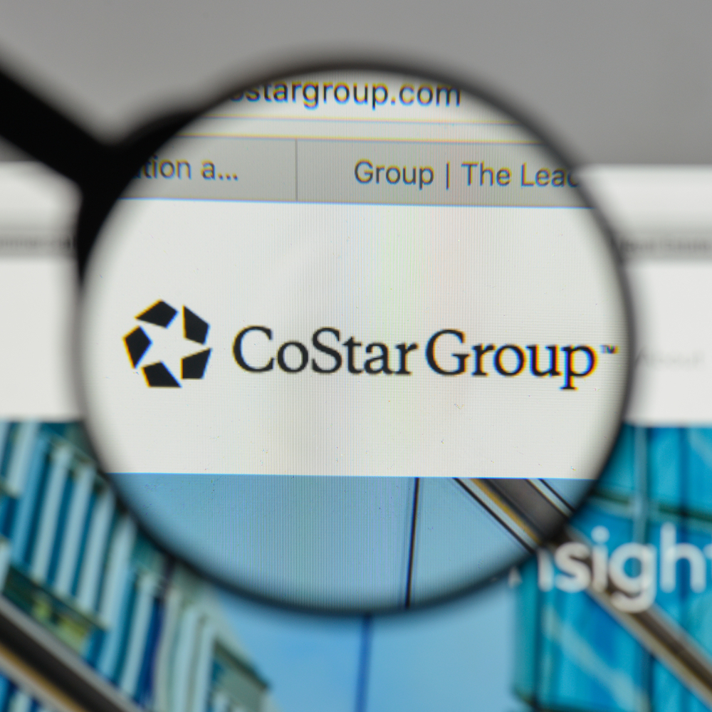 Real Estate - Costar Group, Inc_ magnified logo-by Casimiro PT via Shutterstock