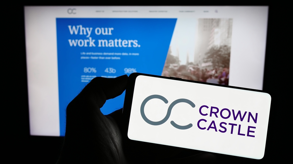 Real Estate - Crown Castle Inc logo on phone and website-by T_Schneider via Shutterstock