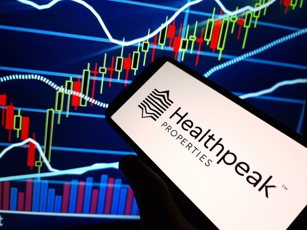 Real Estate - Healthpeak Properties Inc_ logo on phone and chart-by Piotr Swat via Shutterstock