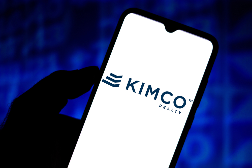 Real Estate - Kimco Realty Corporation logo on phone-by rafapress via Shutterstock