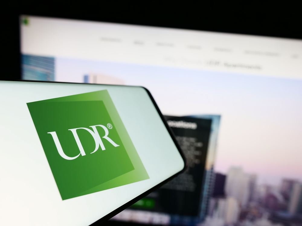 Real Estate - UDR Inc logo on phone with website-by T_Schneider via Shutterstock