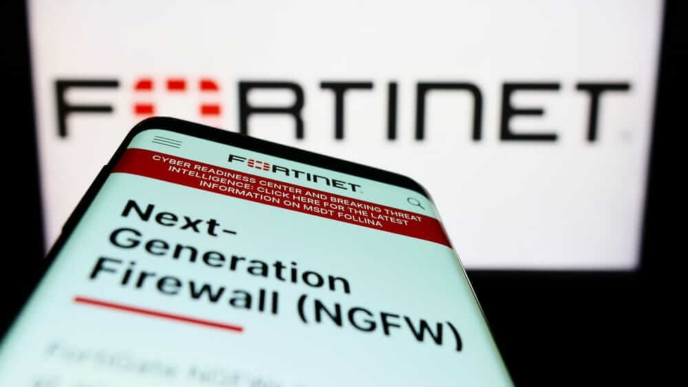 Fortinet Inc website on phone and logo-by T_Schneider via Shutterstock