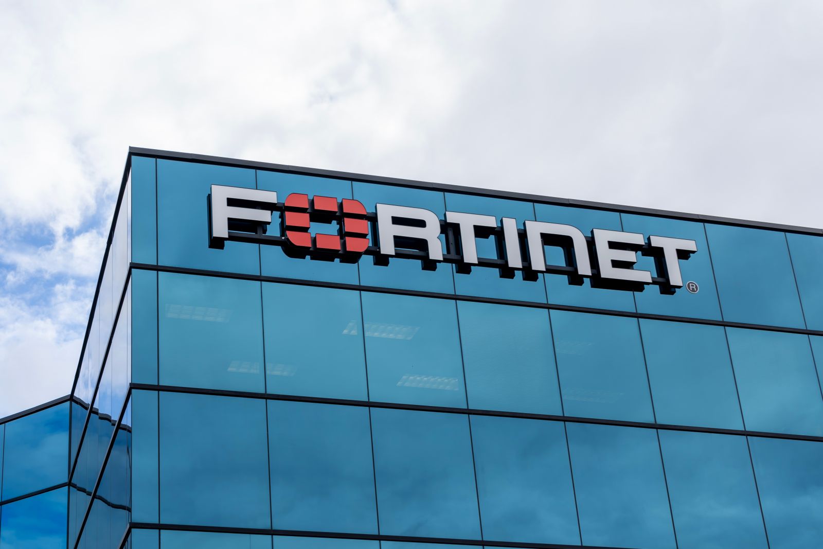 Fortinet Technologies logo sign on the building_ Ottawa, ON, Canada - October 15, 2023_ Fortinet is a cybersecurity company_By JHVEPhoto