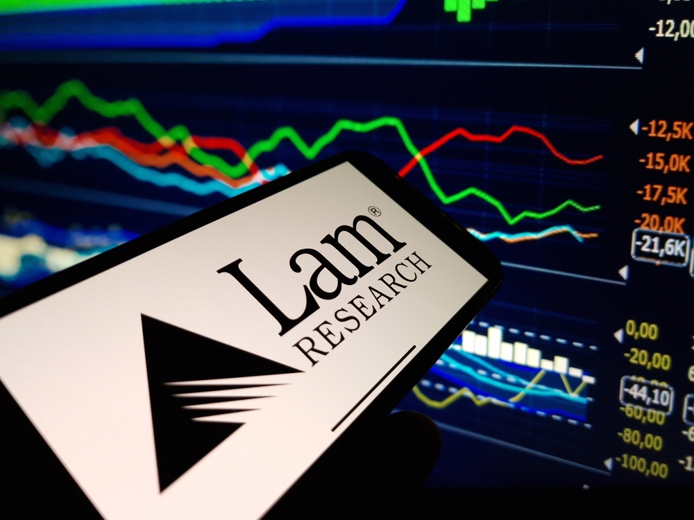 Technology (names J - Z) - Lam Research Corp_ logo on phone and stock chart-by Piotr Swat via Shutterstock