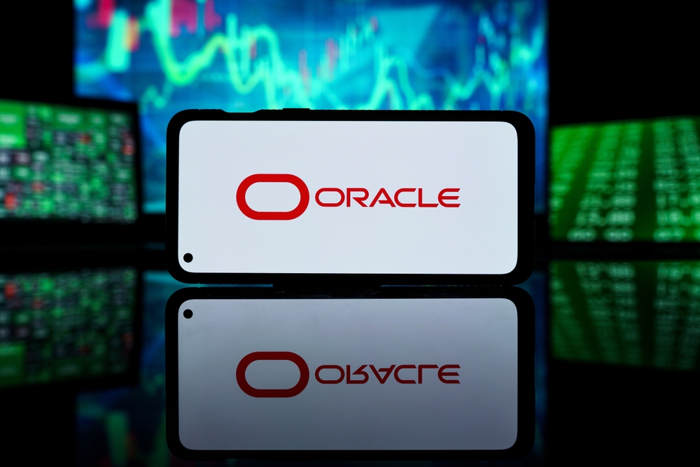 Technology (names J - Z) - Oracle Corp_ logo on phone and stock data-by Rokas Tenys via Shutterstock