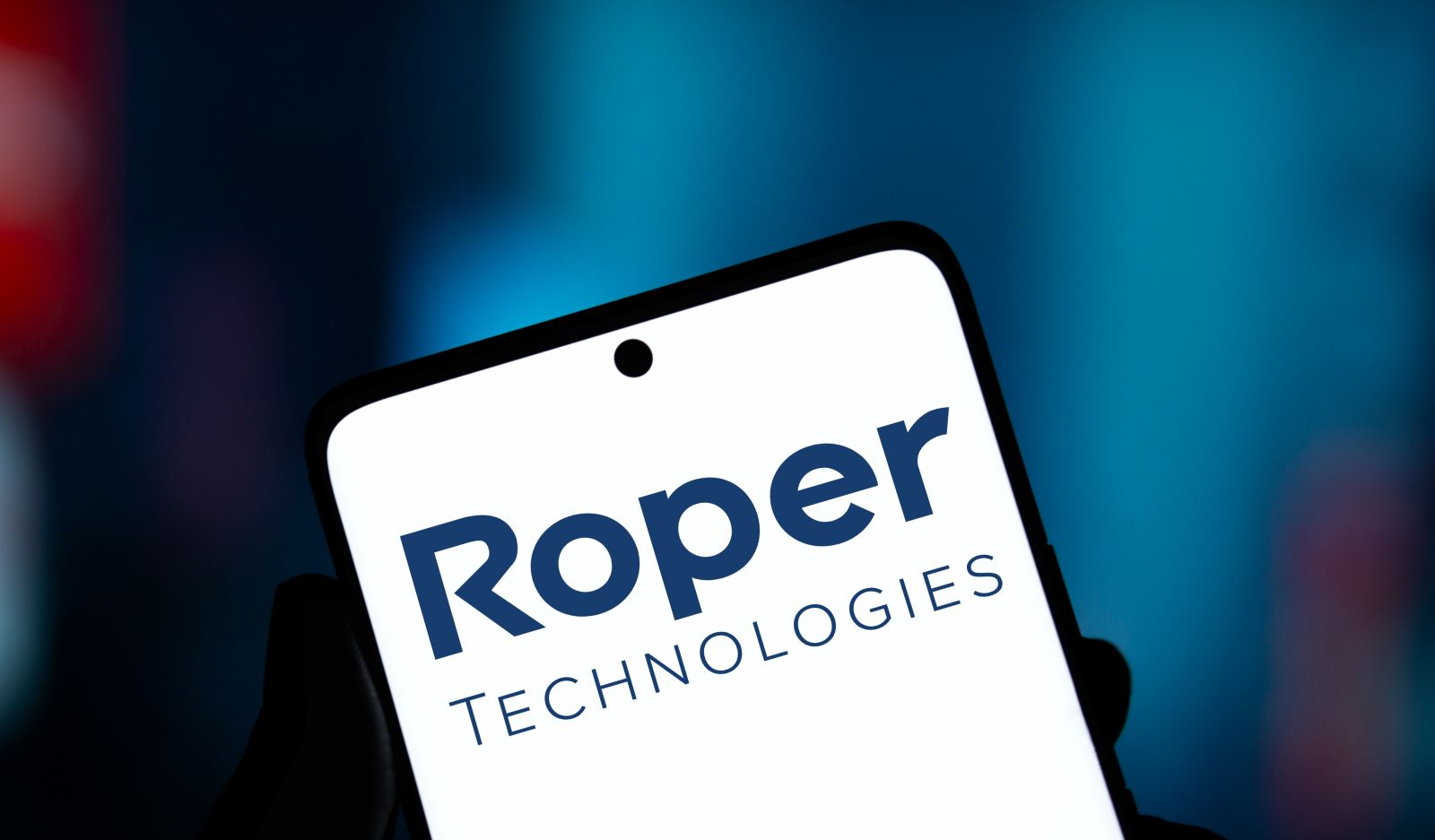 Roper Technologies logo is displayed on smartphone_ By Mojahid Mottakin