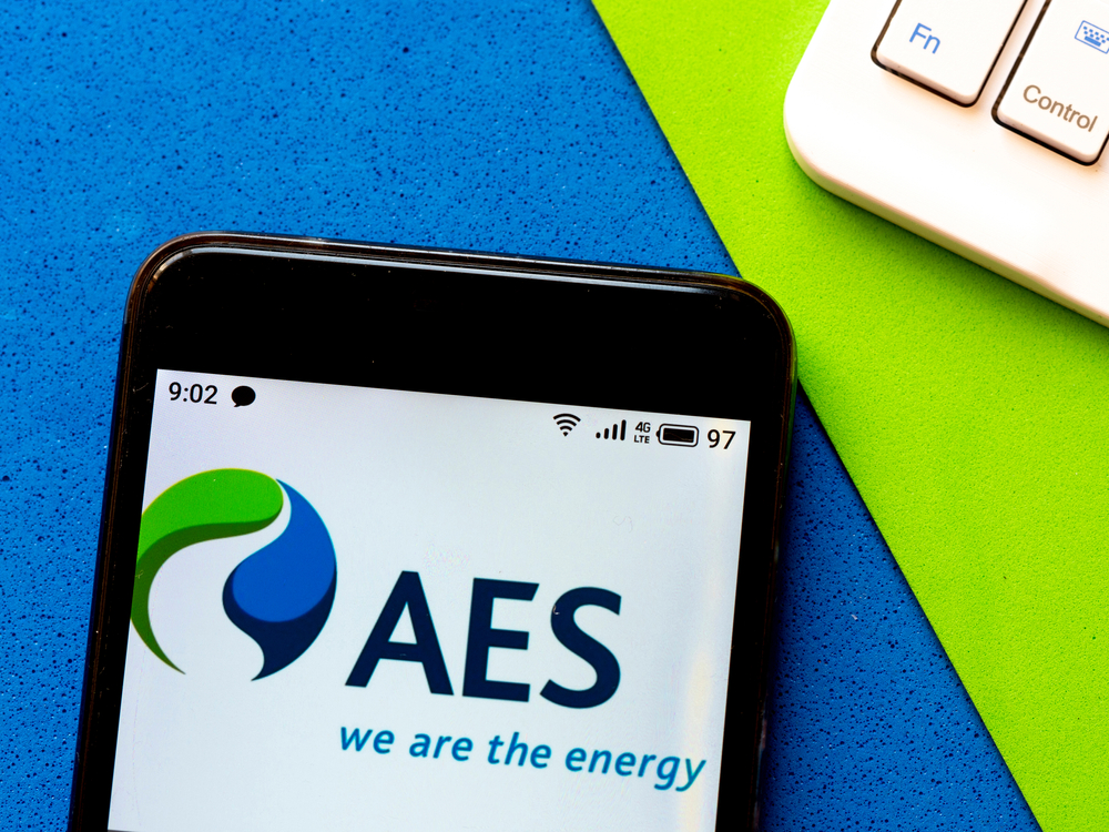 Utilities - AES Corp_ logo on phone-by IgorGolovniov via Shutterstock