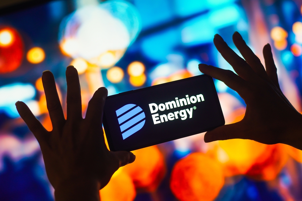 Utilities - Dominion Energy Inc smartphone with logo-by rafapress via Shutterstock