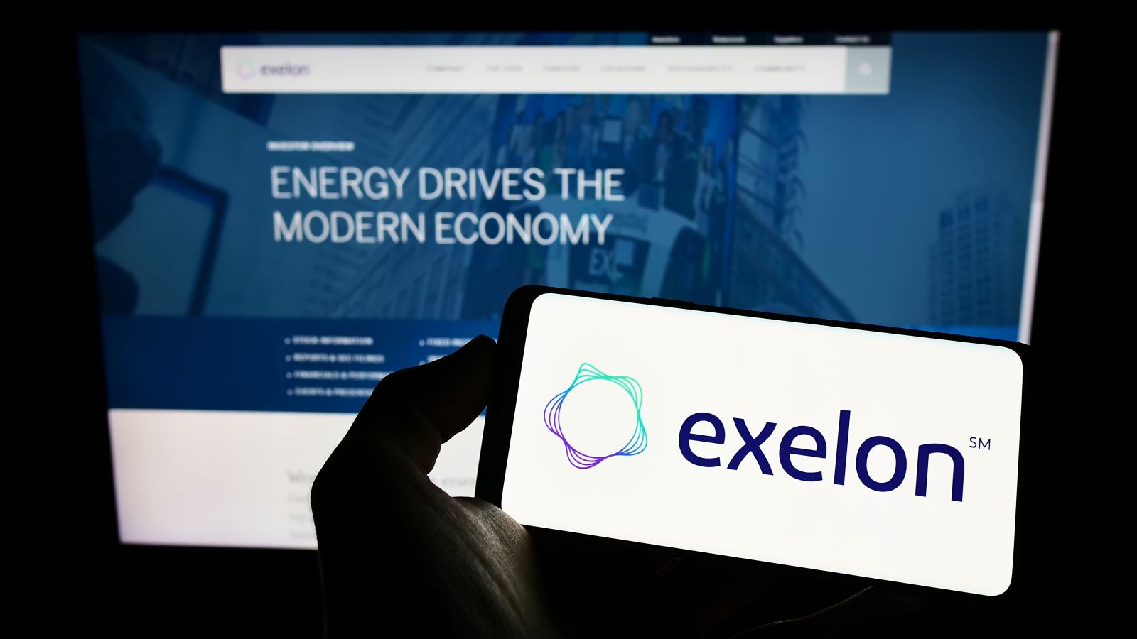 Exelon Corporation on screen in front of business webpage By Timon