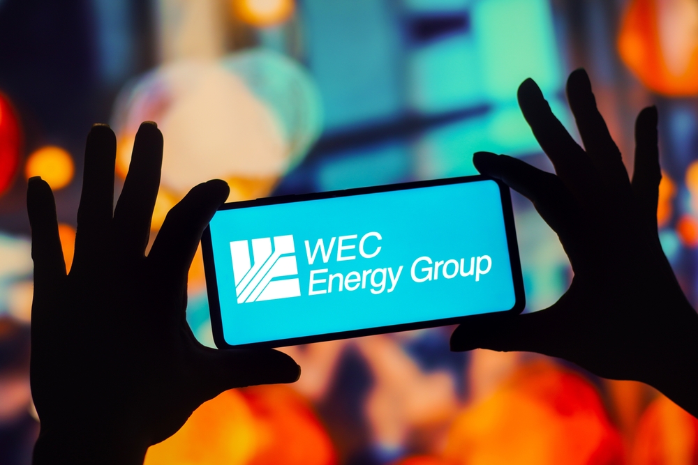 Utilities - WEC Energy Group Inc logo on phone-by rafapress via Shutterstock