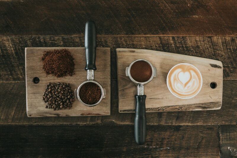 Coffee - Beans and Filled Cups of Espresso on Wooden Board