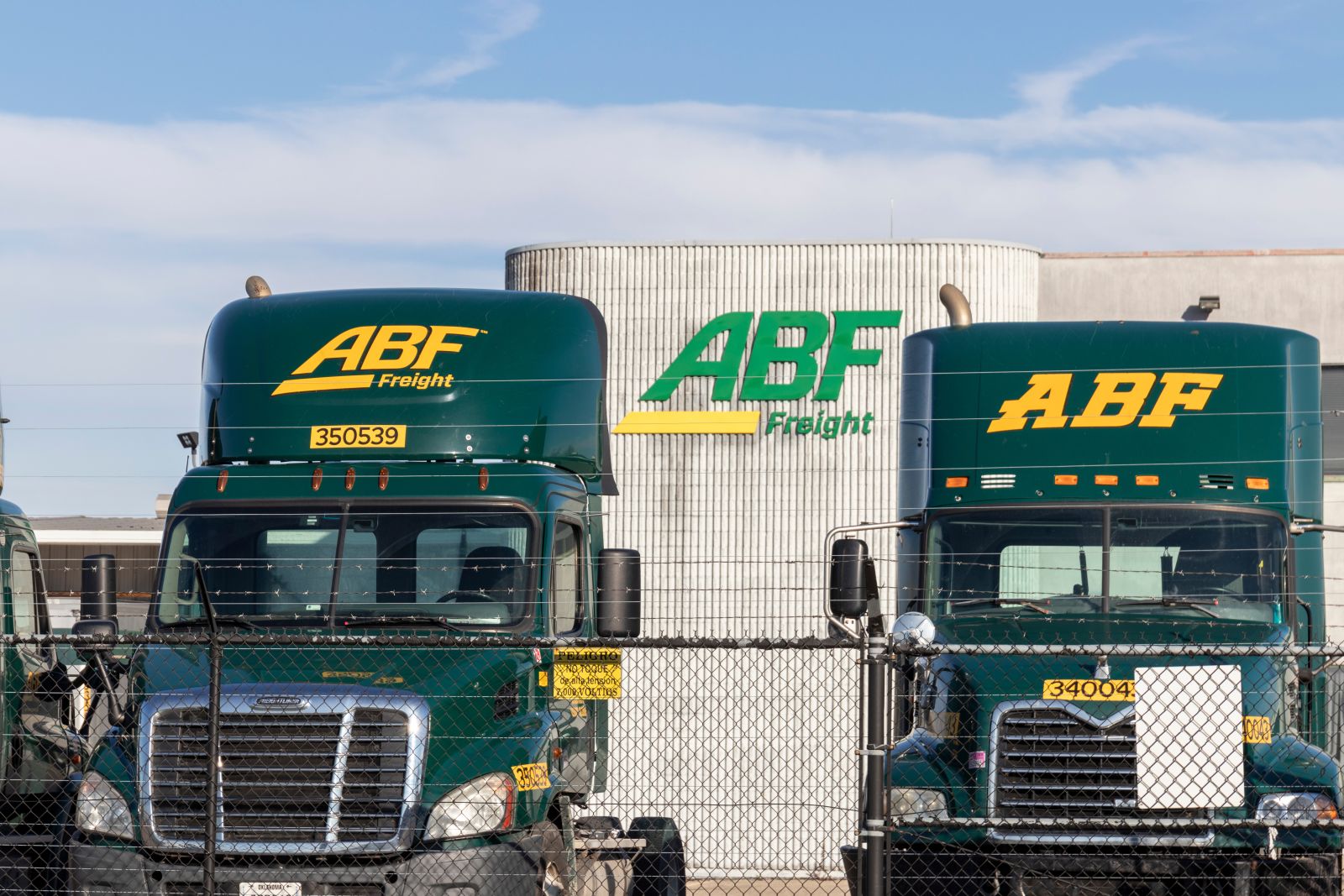 A head-on view of two ArcBest freight trucks by jetcityimage via Adobe Stock