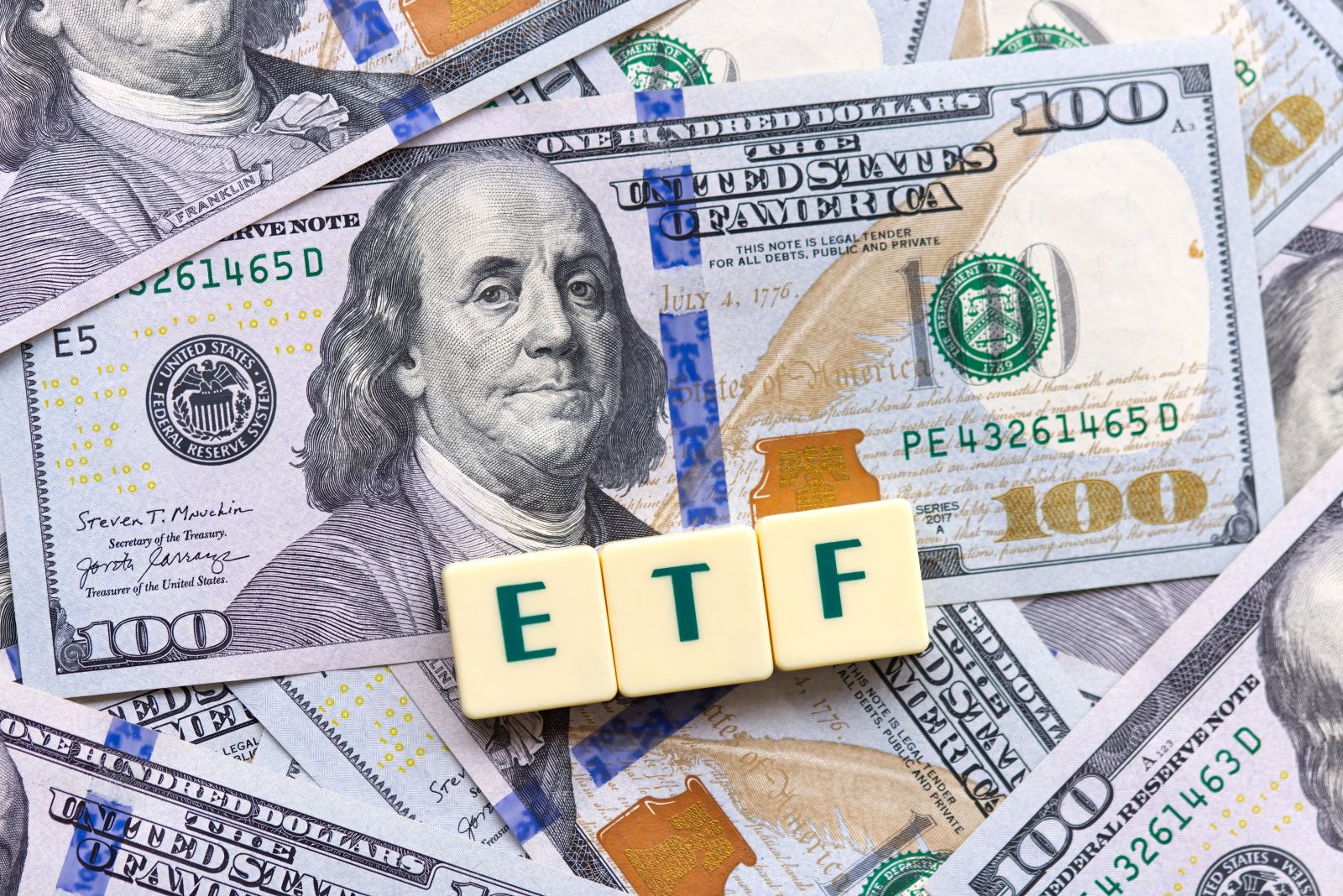 ETF and $100 bills by Below the Sky via Shutterstock