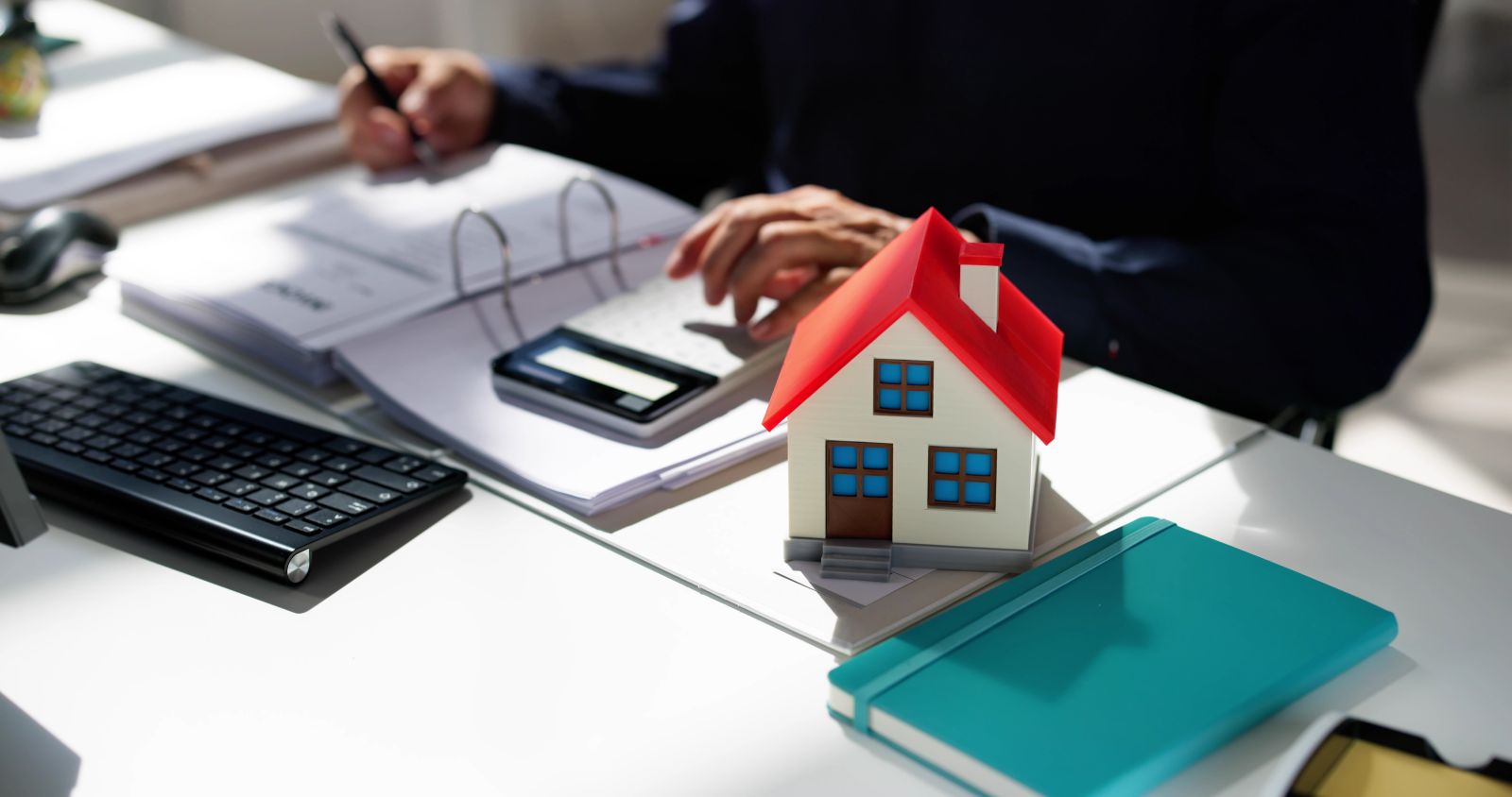 Calculating mortgage costs by Andrey_Popov via Shutterstock