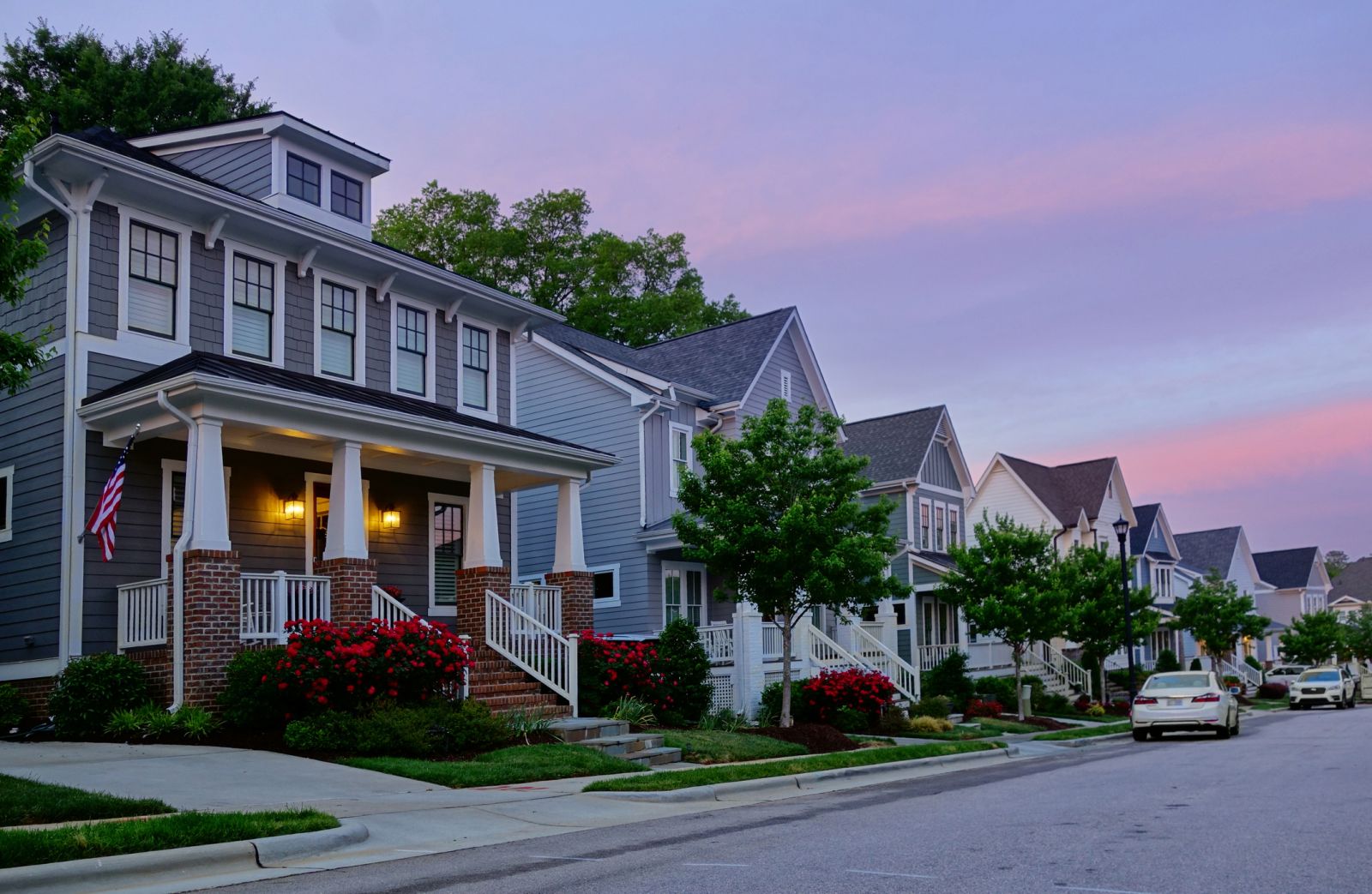 Housing and Real Estate - New homes on a quiet street by zimmytws via iStock