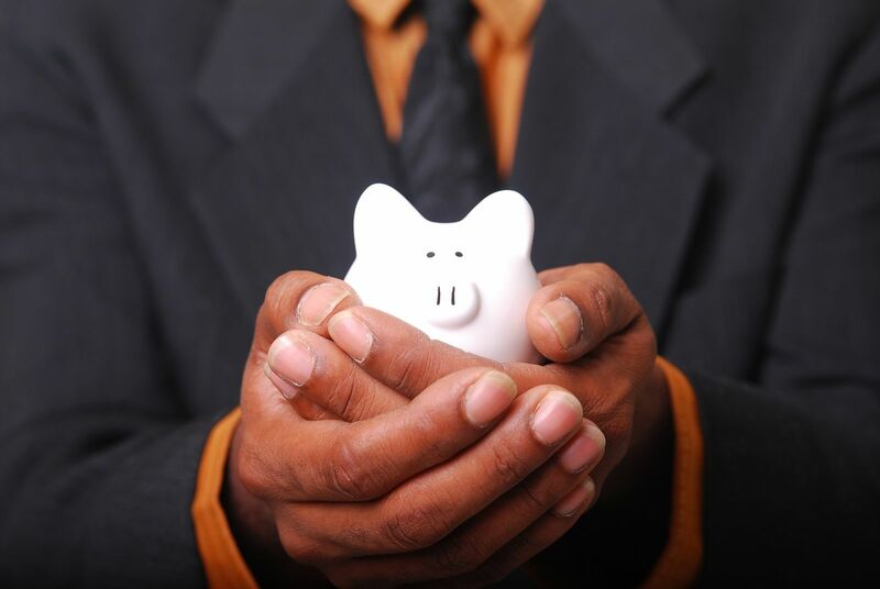 Savings - Piggybank Man Holding