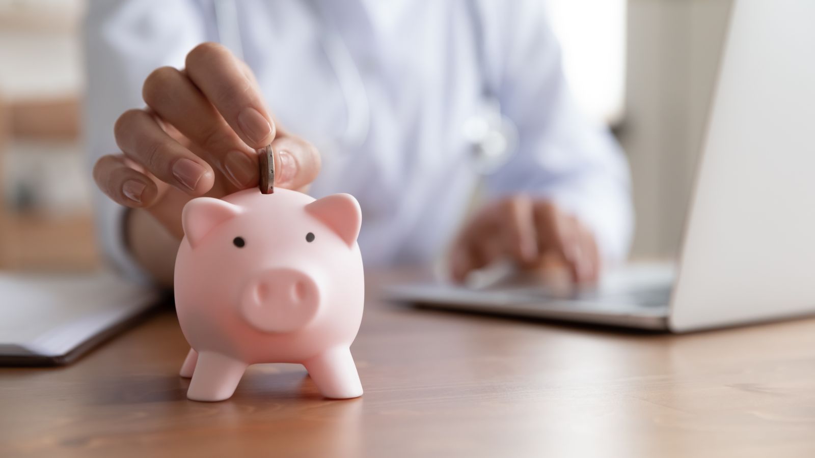 Savings piggybank desk by Fizkes via iStock