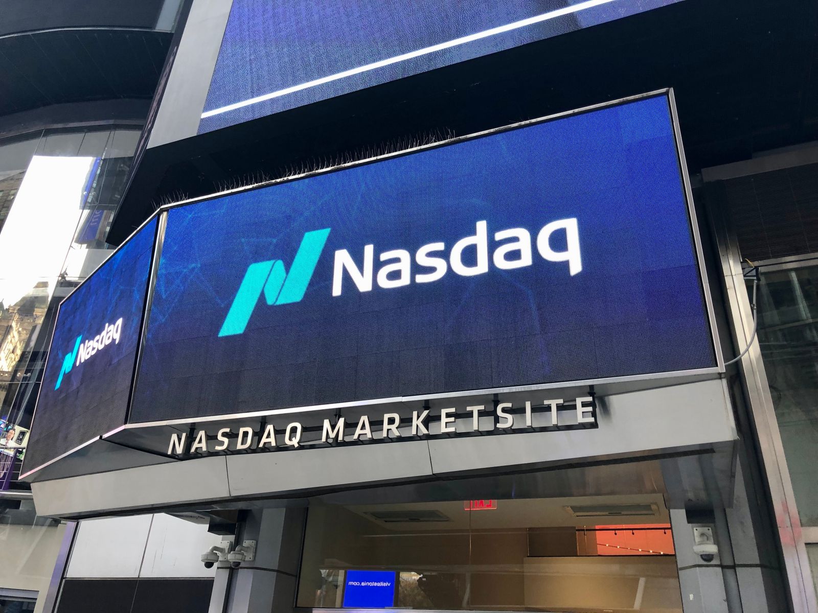 Wall Street - NASDAQ sign in Times Square by MacroEcon via Shutterstock