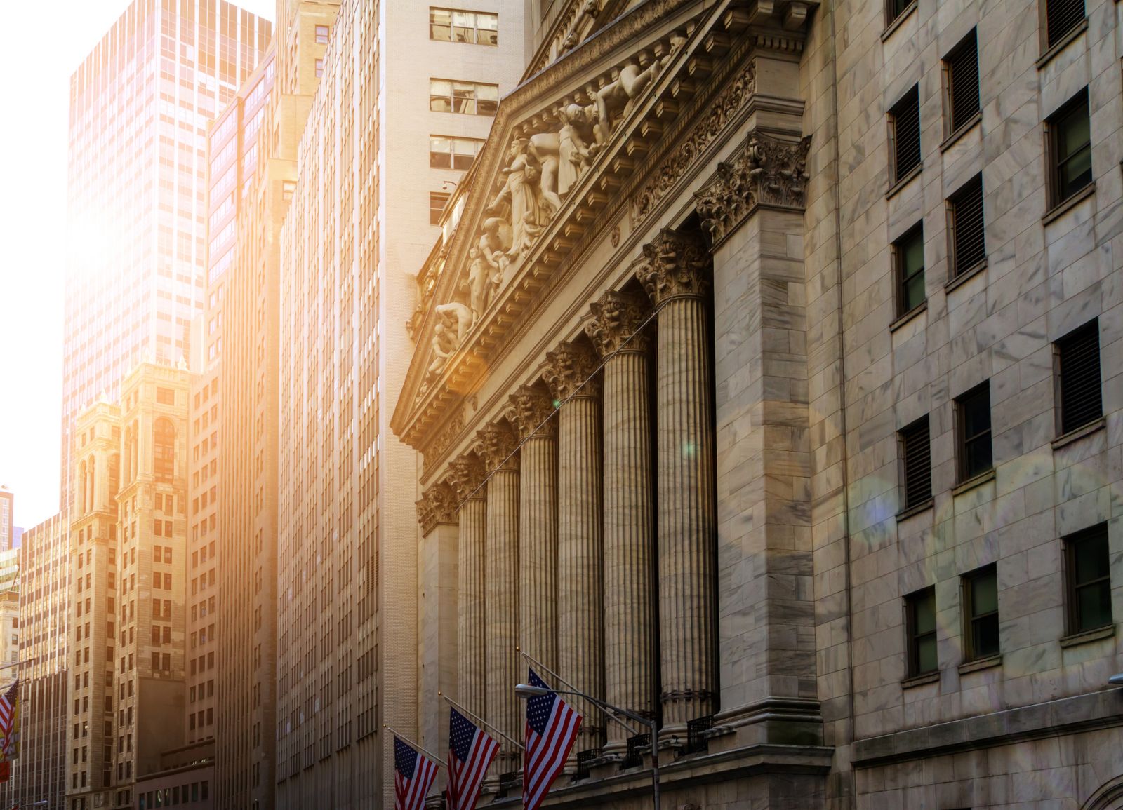 Wall Street - New York Stock Exchange during sunrise by Deberarr via iStock