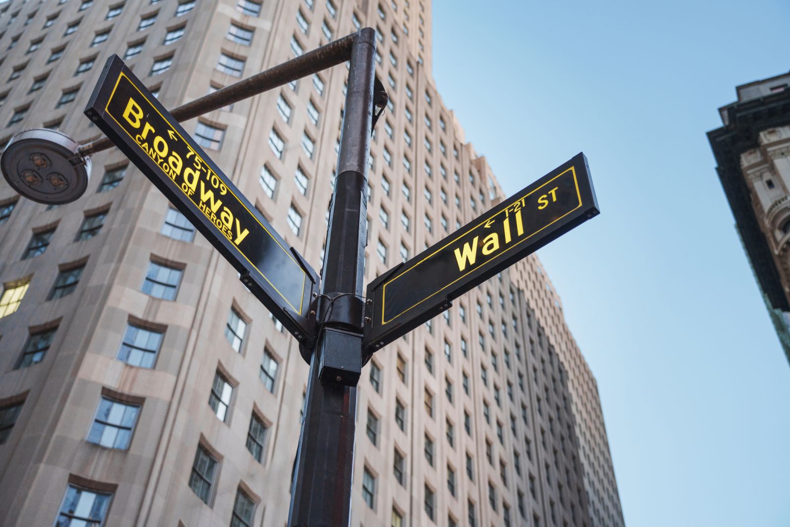 Wall Street - Wall Street sign in New York in the evening by FotorafieLink via iStock