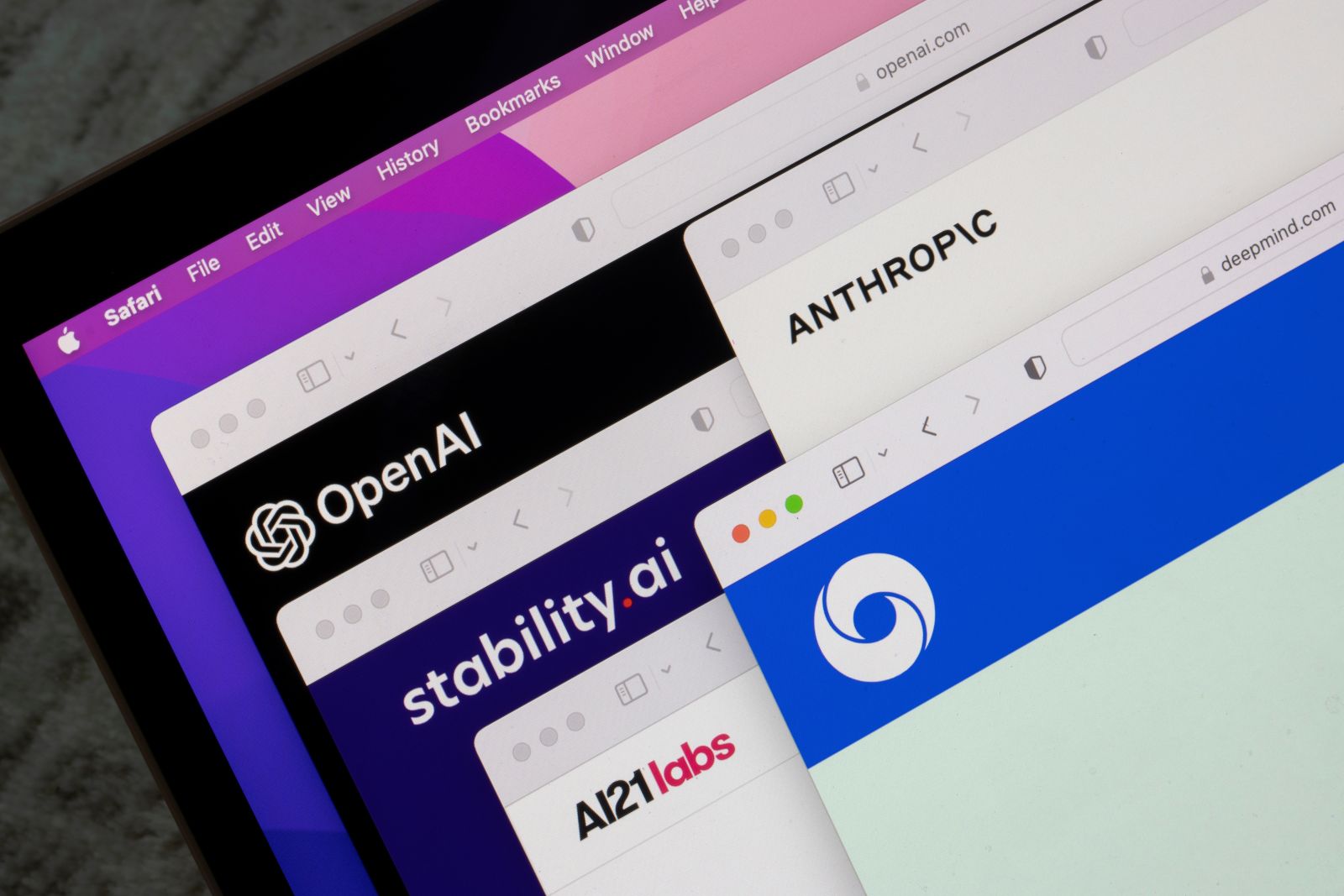 AI (artificial intelligence) - OpenAI, Stability AI, AI21 Labs, Anthropic, and Deepmind logos are seen on their websites on a computer by Tada Images via Shutterstock