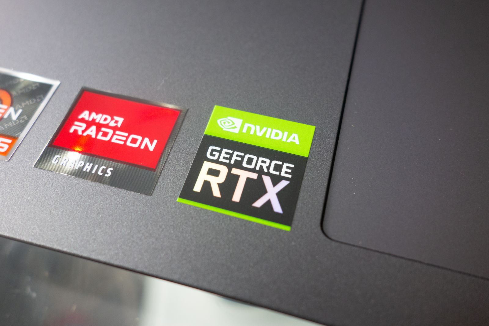 Tech (Ecommerce, Social Media, etc.) - Stickers with AMD Radeon and Nvidia GeForce RTX graphics on new laptop computer by Piotr Swat via Shutterstock