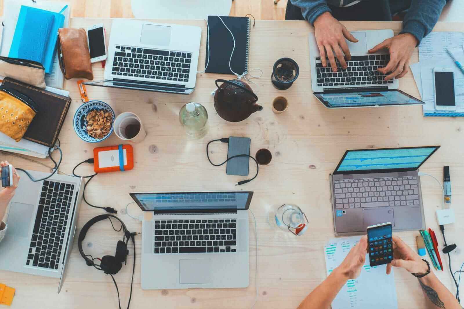 Table covered with assorted technology by Marvin Meyer via Unsplash