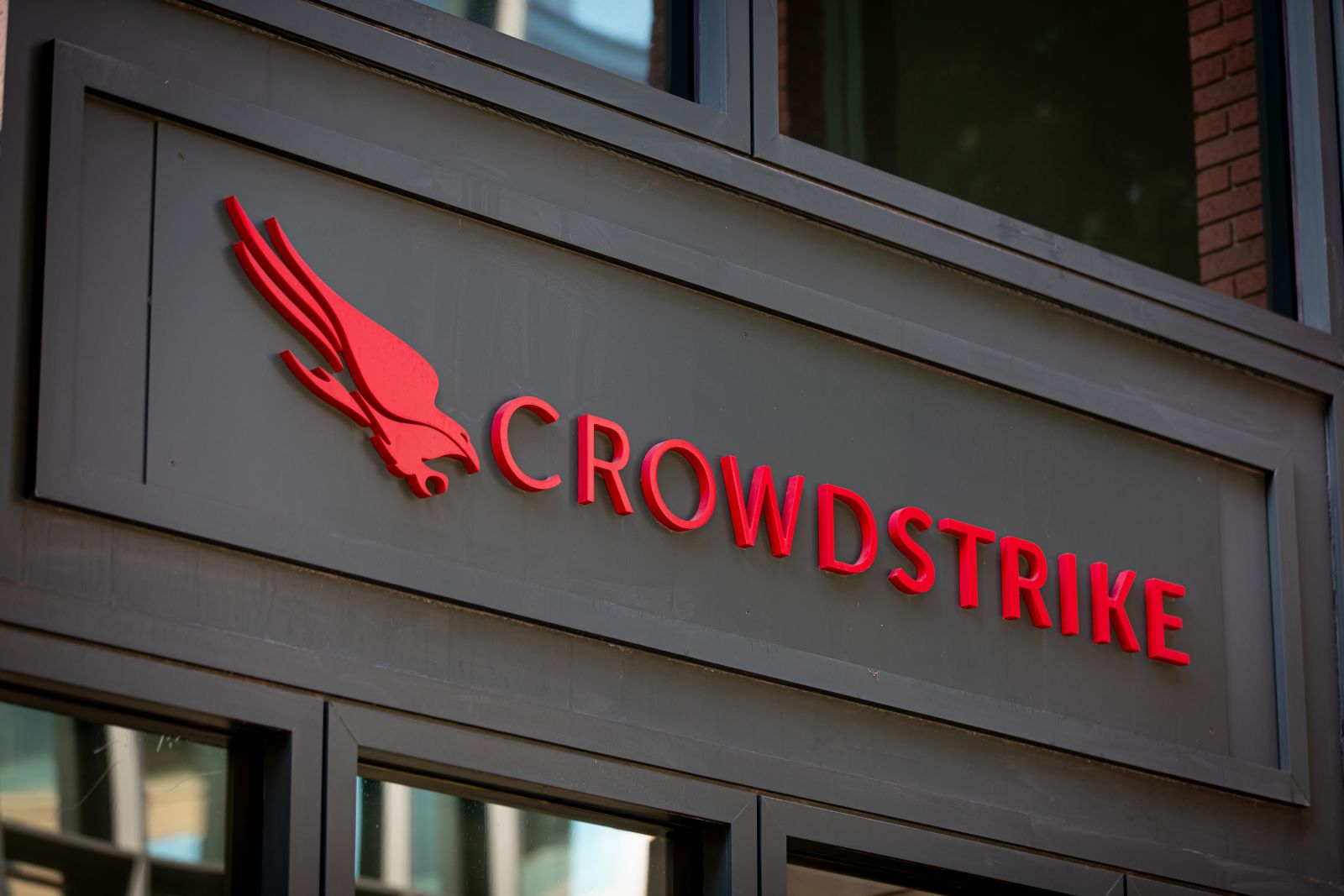 The CrowdStrike logo on an office building by bluestork via Shutterstock