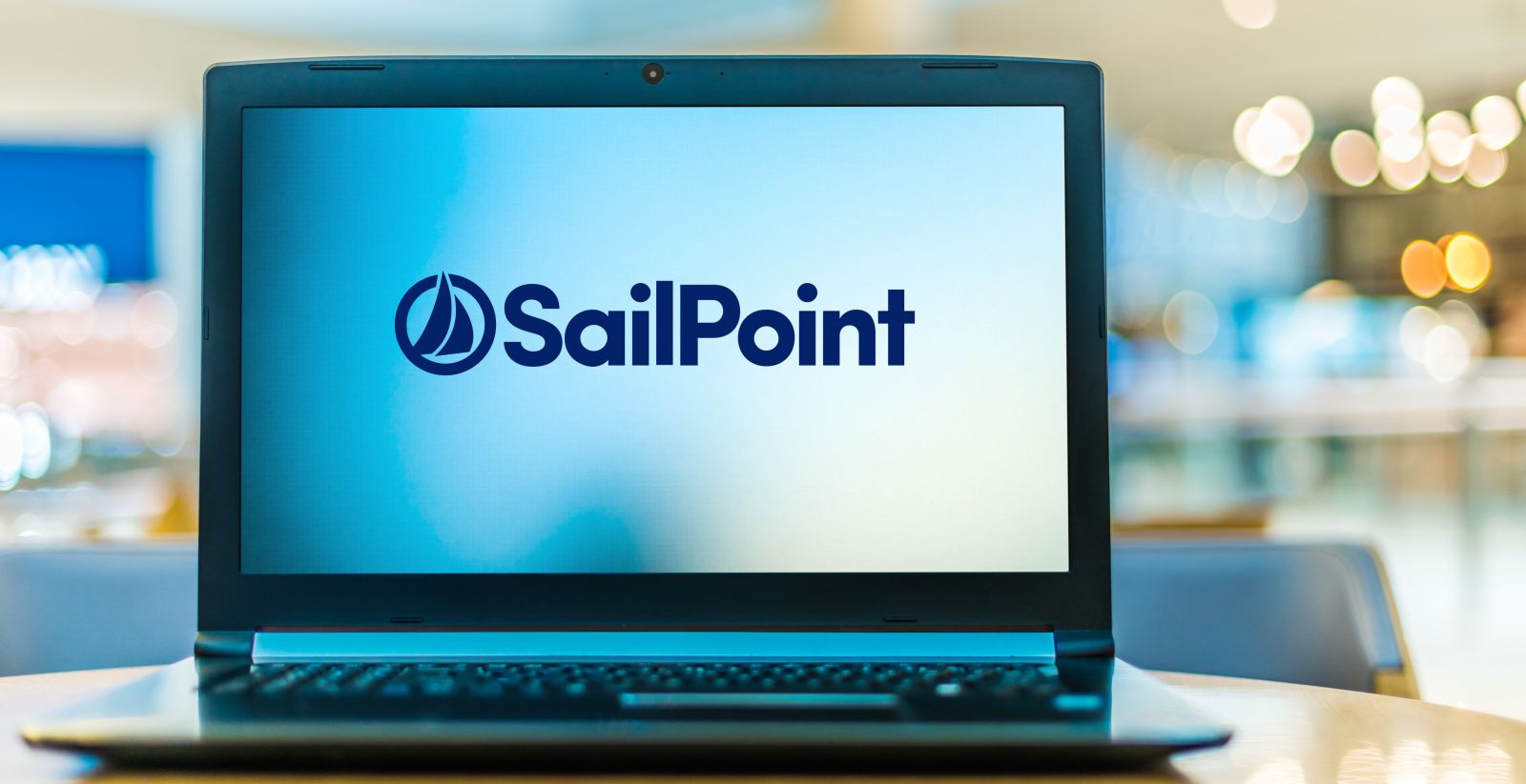 The SailPoint logo displayed on a laptop screen by monticellllo via Adobe Stock