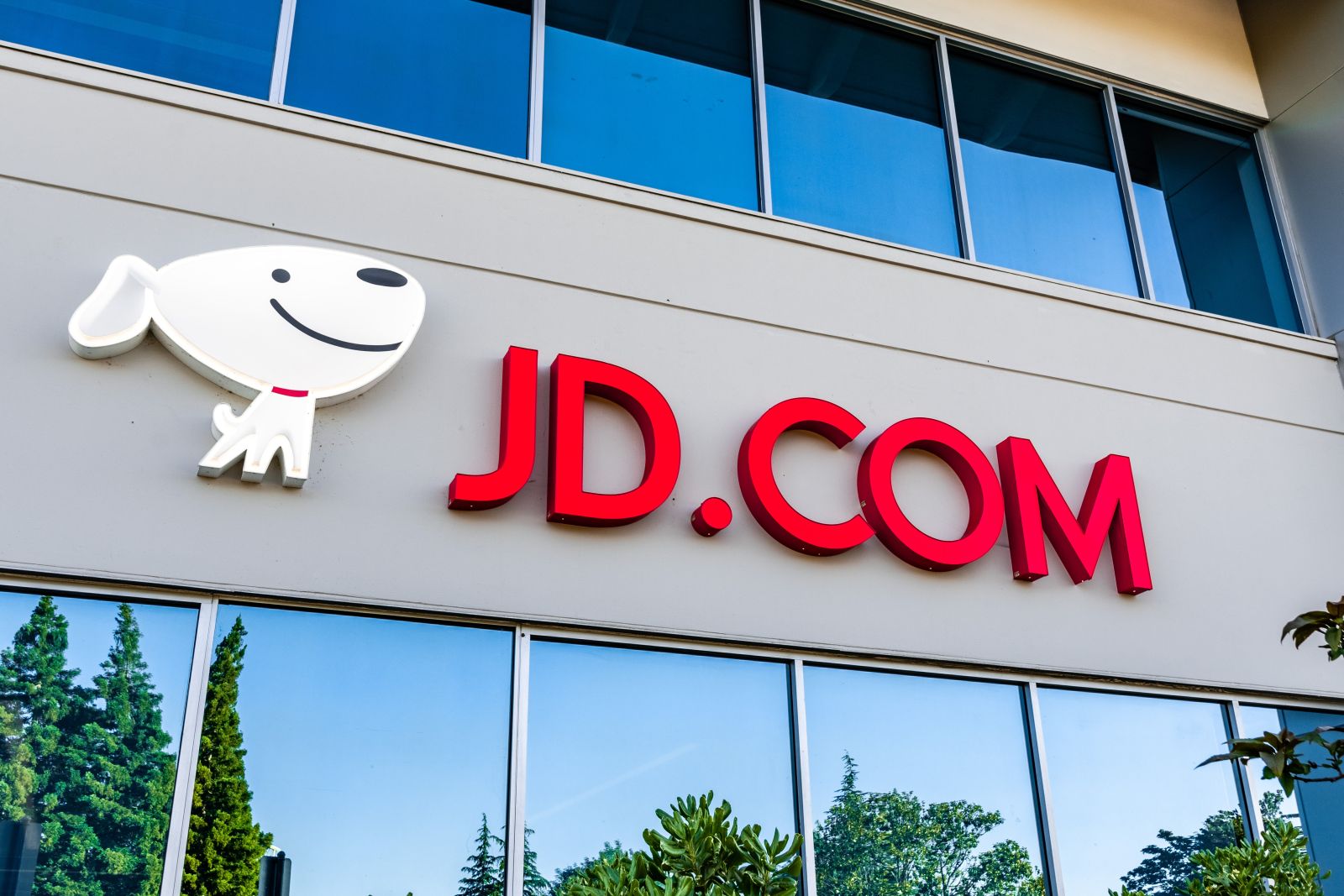 The logo for JD displayed on an office building by Sundry Photography via Adobe Stock