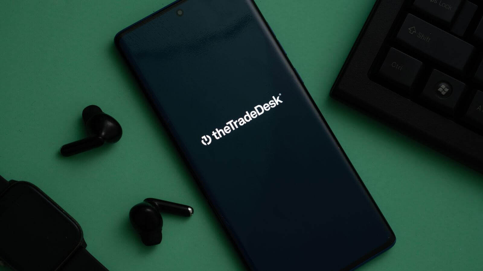 The logo for The Trade Desk displayed on a smartphone screen by Mamun_Sheikh via Shutterstock