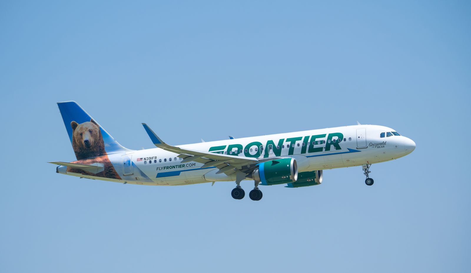 A Frontier aircraft in the sky by Leena Robinson via Shutterstock
