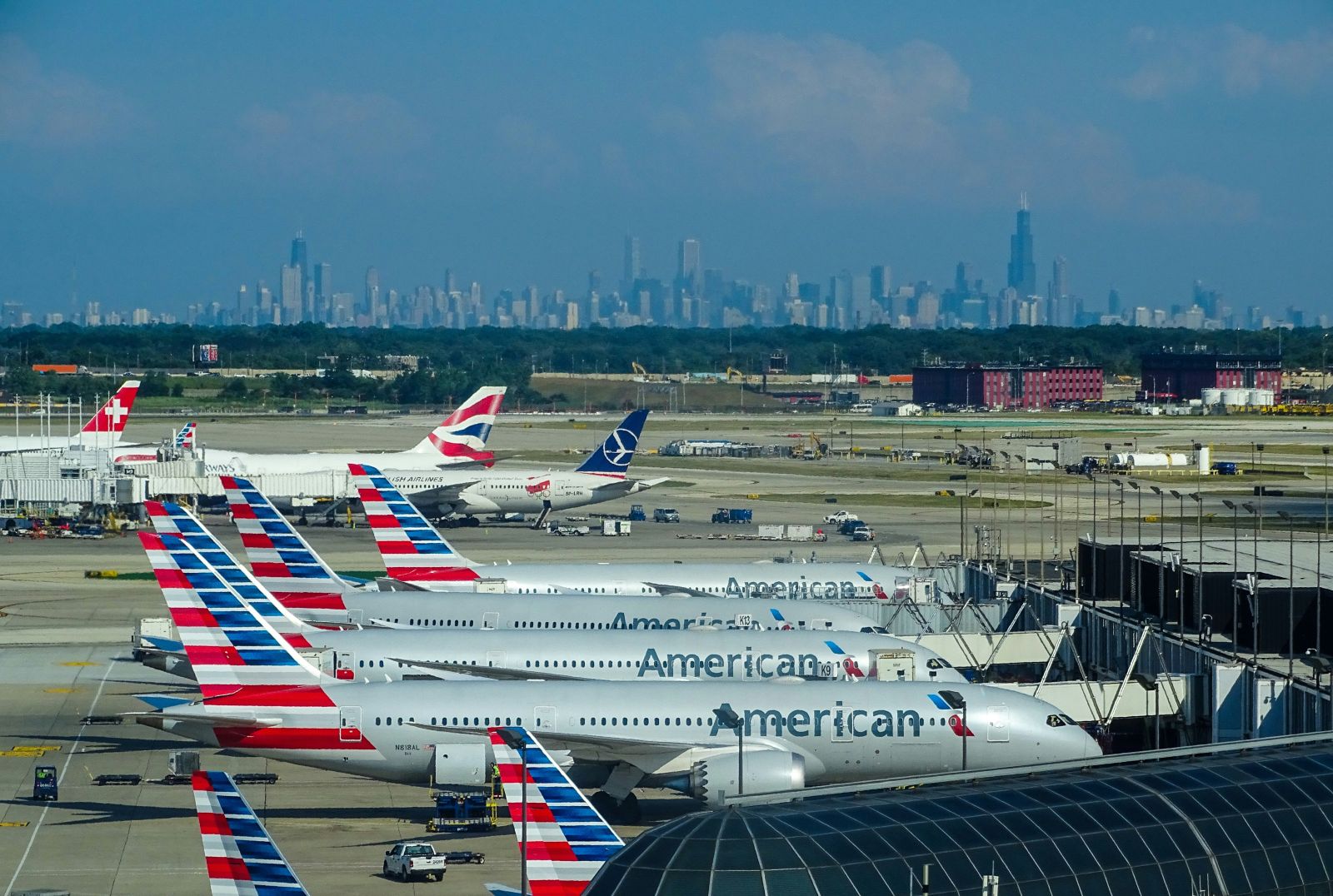 Travel & Leisure - Airplanes parked at gates by Miguel Angel Sanz via Unsplash