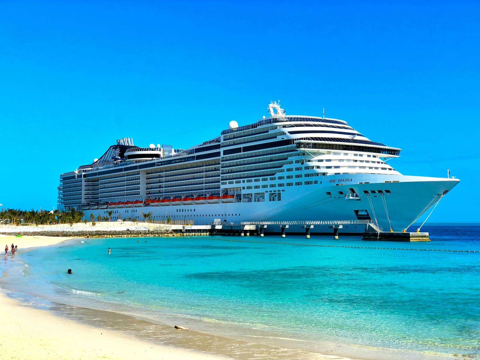 Cruise ship docked on beach by Georgy Trofimov via Unsplash