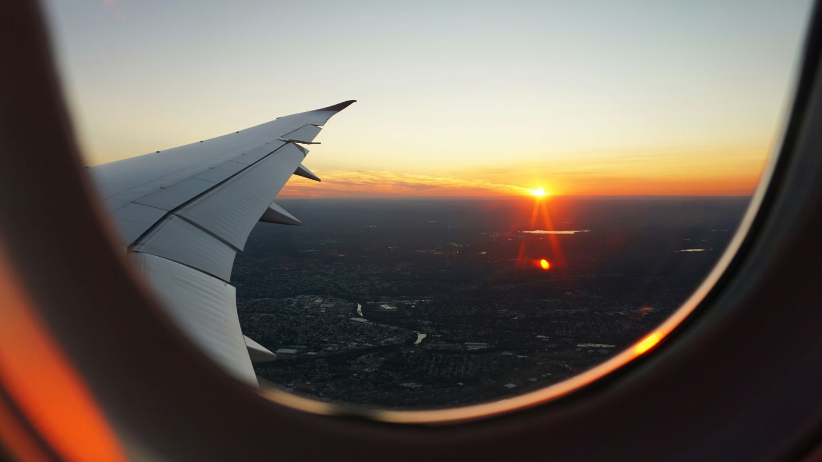 Travel & Leisure - Window view from airplane during golden hour by Eva Darron via Unsplash