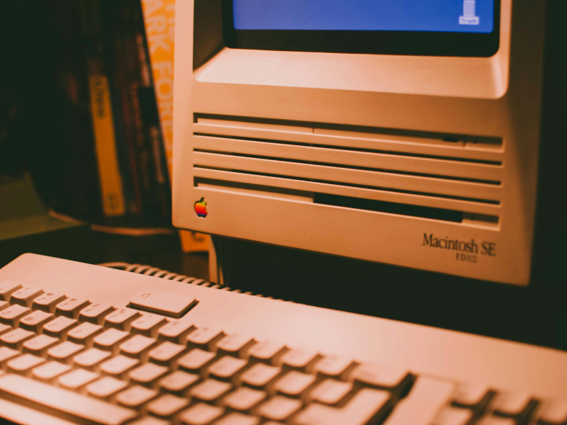 White computer keyboard on black table by Jack Guo via Unsplash